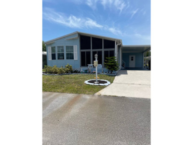 Welcome to your dream retreat! This cute Little Blue Cottage is on Blue Heron Pines Golf Course in Florida - for sale on GolfHomes.com, golf home, golf lot