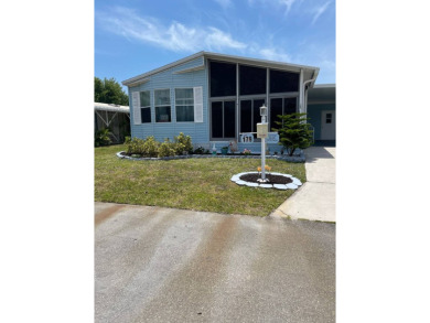 Welcome to your dream retreat! This cute Little Blue Cottage is on Blue Heron Pines Golf Course in Florida - for sale on GolfHomes.com, golf home, golf lot