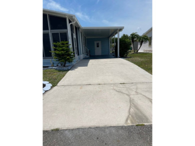 Welcome to your dream retreat! This cute Little Blue Cottage is on Blue Heron Pines Golf Course in Florida - for sale on GolfHomes.com, golf home, golf lot