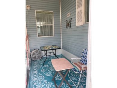 Welcome to your dream retreat! This cute Little Blue Cottage is on Blue Heron Pines Golf Course in Florida - for sale on GolfHomes.com, golf home, golf lot