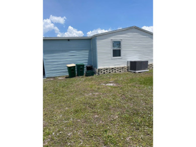 Welcome to your dream retreat! This cute Little Blue Cottage is on Blue Heron Pines Golf Course in Florida - for sale on GolfHomes.com, golf home, golf lot