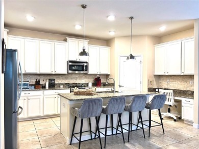 Under contract-accepting backup offers. New reduced price! on The Oasis Club at Champions Gate in Florida - for sale on GolfHomes.com, golf home, golf lot