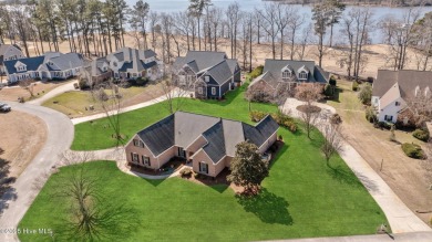 Experience luxury living in this exquisite home nestled in the on Sound Golf Links at Albemarle Plantation in North Carolina - for sale on GolfHomes.com, golf home, golf lot