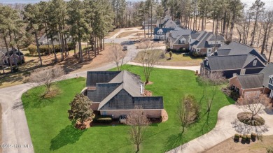 Experience luxury living in this exquisite home nestled in the on Sound Golf Links at Albemarle Plantation in North Carolina - for sale on GolfHomes.com, golf home, golf lot