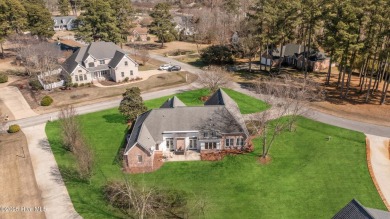 Experience luxury living in this exquisite home nestled in the on Sound Golf Links at Albemarle Plantation in North Carolina - for sale on GolfHomes.com, golf home, golf lot