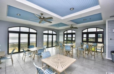 Enjoy resort-style living in this fully furnished 2-bedroom on Barefoot Resort and Golf Club  in South Carolina - for sale on GolfHomes.com, golf home, golf lot