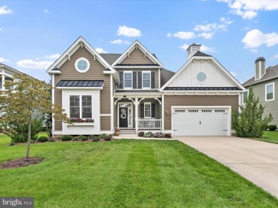 The welcoming covered entry of 33437 Islander Drive invites you on The Peninsula Golf and Country Club in Delaware - for sale on GolfHomes.com, golf home, golf lot