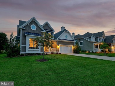The welcoming covered entry of 33437 Islander Drive invites you on The Peninsula Golf and Country Club in Delaware - for sale on GolfHomes.com, golf home, golf lot