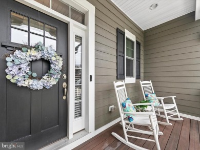 The welcoming covered entry of 33437 Islander Drive invites you on The Peninsula Golf and Country Club in Delaware - for sale on GolfHomes.com, golf home, golf lot