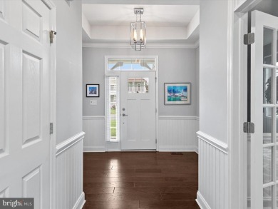 The welcoming covered entry of 33437 Islander Drive invites you on The Peninsula Golf and Country Club in Delaware - for sale on GolfHomes.com, golf home, golf lot