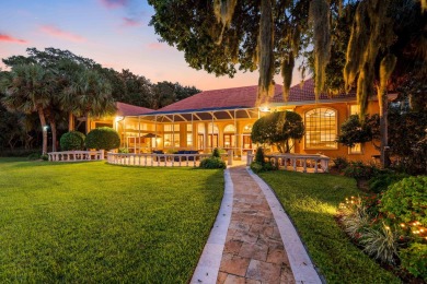 WESTWARD-FACING SINGLE-STORY WATERFRONT ESTATE WITHIN ESTEEMED on Kelly Plantation Golf Club in Florida - for sale on GolfHomes.com, golf home, golf lot