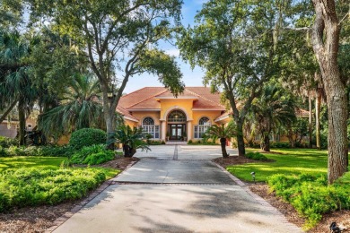 WESTWARD-FACING SINGLE-STORY WATERFRONT ESTATE WITHIN ESTEEMED on Kelly Plantation Golf Club in Florida - for sale on GolfHomes.com, golf home, golf lot