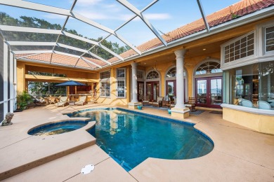 WESTWARD-FACING SINGLE-STORY WATERFRONT ESTATE WITHIN ESTEEMED on Kelly Plantation Golf Club in Florida - for sale on GolfHomes.com, golf home, golf lot