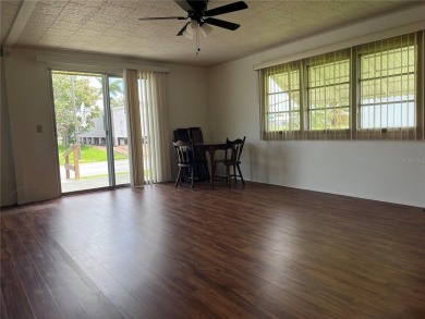 Come see this cheery yellow home, and enjoy sunny Florida living on Heather Hills Golf Course in Florida - for sale on GolfHomes.com, golf home, golf lot