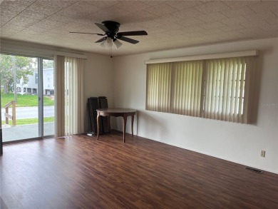 Come see this cheery yellow home, and enjoy sunny Florida living on Heather Hills Golf Course in Florida - for sale on GolfHomes.com, golf home, golf lot