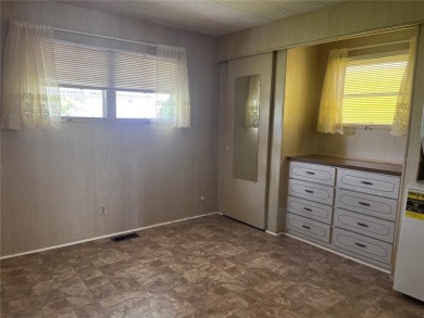 Come see this cheery yellow home, and enjoy sunny Florida living on Heather Hills Golf Course in Florida - for sale on GolfHomes.com, golf home, golf lot