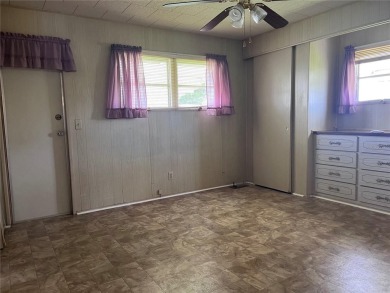 Come see this cheery yellow home, and enjoy sunny Florida living on Heather Hills Golf Course in Florida - for sale on GolfHomes.com, golf home, golf lot