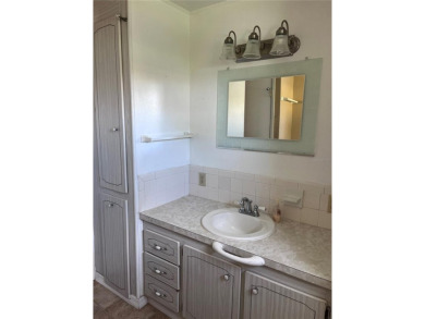 Come see this cheery yellow home, and enjoy sunny Florida living on Heather Hills Golf Course in Florida - for sale on GolfHomes.com, golf home, golf lot