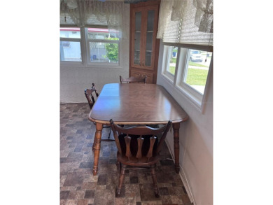 Come see this cheery yellow home, and enjoy sunny Florida living on Heather Hills Golf Course in Florida - for sale on GolfHomes.com, golf home, golf lot