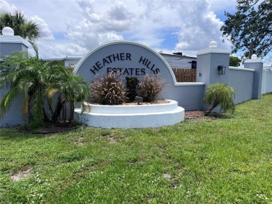 Come see this cheery yellow home, and enjoy sunny Florida living on Heather Hills Golf Course in Florida - for sale on GolfHomes.com, golf home, golf lot