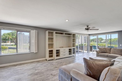 BEAUTIFULLY UPDATED FIRST FLOOR CORNER UNIT, PRIVATE & IDEALLY on BallenIsles Golf and Country Club in Florida - for sale on GolfHomes.com, golf home, golf lot