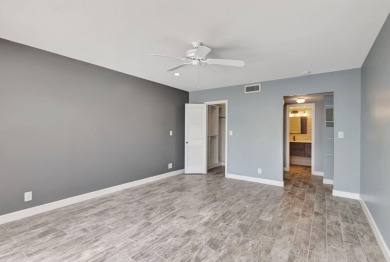 BEAUTIFULLY UPDATED FIRST FLOOR CORNER UNIT, PRIVATE & IDEALLY on BallenIsles Golf and Country Club in Florida - for sale on GolfHomes.com, golf home, golf lot