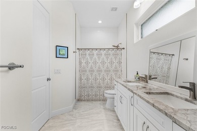 MAGNIFICENT CUSTOM BUILT, WATERFRONT HOME WITH 3,849 SQ FT OF on Palmetto-Pine Country Club in Florida - for sale on GolfHomes.com, golf home, golf lot