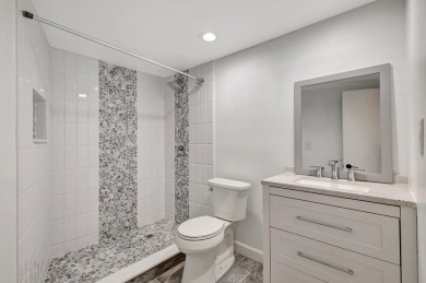 BEAUTIFULLY UPDATED FIRST FLOOR CORNER UNIT, PRIVATE & IDEALLY on BallenIsles Golf and Country Club in Florida - for sale on GolfHomes.com, golf home, golf lot
