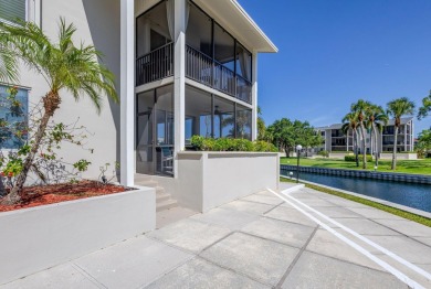 BEAUTIFULLY UPDATED FIRST FLOOR CORNER UNIT, PRIVATE & IDEALLY on BallenIsles Golf and Country Club in Florida - for sale on GolfHomes.com, golf home, golf lot