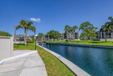 BEAUTIFULLY UPDATED FIRST FLOOR CORNER UNIT, PRIVATE & IDEALLY on BallenIsles Golf and Country Club in Florida - for sale on GolfHomes.com, golf home, golf lot