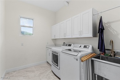 MAGNIFICENT CUSTOM BUILT, WATERFRONT HOME WITH 3,849 SQ FT OF on Palmetto-Pine Country Club in Florida - for sale on GolfHomes.com, golf home, golf lot