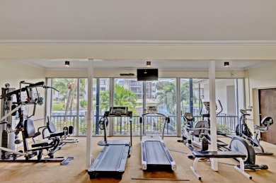 BEAUTIFULLY UPDATED FIRST FLOOR CORNER UNIT, PRIVATE & IDEALLY on BallenIsles Golf and Country Club in Florida - for sale on GolfHomes.com, golf home, golf lot