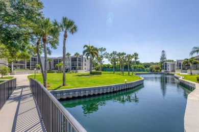 BEAUTIFULLY UPDATED FIRST FLOOR CORNER UNIT, PRIVATE & IDEALLY on BallenIsles Golf and Country Club in Florida - for sale on GolfHomes.com, golf home, golf lot