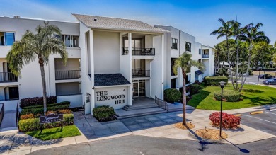 BEAUTIFULLY UPDATED FIRST FLOOR CORNER UNIT, PRIVATE & IDEALLY on BallenIsles Golf and Country Club in Florida - for sale on GolfHomes.com, golf home, golf lot