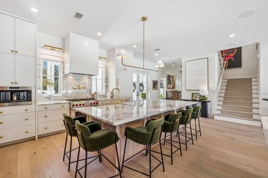 This Stunning 5-bedroom, 5.5-bath luxury residence overlooks the on Origins Golf Club in Florida - for sale on GolfHomes.com, golf home, golf lot