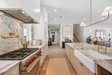 This Stunning 5-bedroom, 5.5-bath luxury residence overlooks the on Origins Golf Club in Florida - for sale on GolfHomes.com, golf home, golf lot