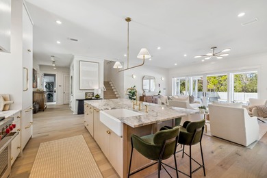 This Stunning 5-bedroom, 5.5-bath luxury residence overlooks the on Origins Golf Club in Florida - for sale on GolfHomes.com, golf home, golf lot