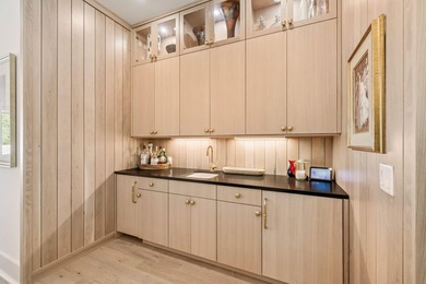 This Stunning 5-bedroom, 5.5-bath luxury residence overlooks the on Origins Golf Club in Florida - for sale on GolfHomes.com, golf home, golf lot