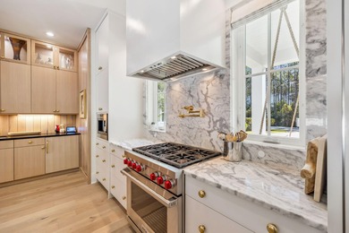 This Stunning 5-bedroom, 5.5-bath luxury residence overlooks the on Origins Golf Club in Florida - for sale on GolfHomes.com, golf home, golf lot