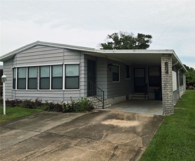 Perfect for seasonal home or rental opportunity! This spacious on Barefoot Bay Golf Course in Florida - for sale on GolfHomes.com, golf home, golf lot