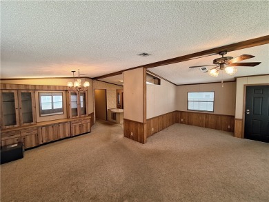 Perfect for seasonal home or rental opportunity! This spacious on Barefoot Bay Golf Course in Florida - for sale on GolfHomes.com, golf home, golf lot