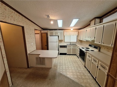 Perfect for seasonal home or rental opportunity! This spacious on Barefoot Bay Golf Course in Florida - for sale on GolfHomes.com, golf home, golf lot