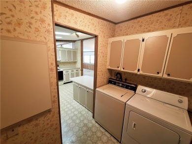 Perfect for seasonal home or rental opportunity! This spacious on Barefoot Bay Golf Course in Florida - for sale on GolfHomes.com, golf home, golf lot