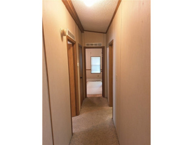 Perfect for seasonal home or rental opportunity! This spacious on Barefoot Bay Golf Course in Florida - for sale on GolfHomes.com, golf home, golf lot