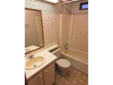 Perfect for seasonal home or rental opportunity! This spacious on Barefoot Bay Golf Course in Florida - for sale on GolfHomes.com, golf home, golf lot