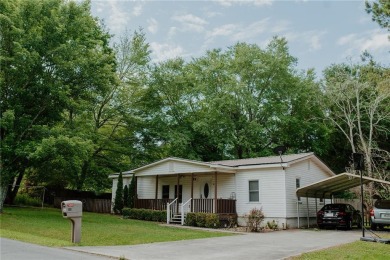 Check out this very welcoming home with a nice leveled front and on Nob North Golf Course in Georgia - for sale on GolfHomes.com, golf home, golf lot