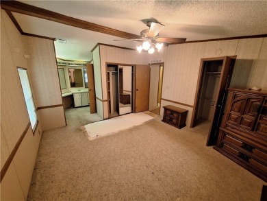 Perfect for seasonal home or rental opportunity! This spacious on Barefoot Bay Golf Course in Florida - for sale on GolfHomes.com, golf home, golf lot