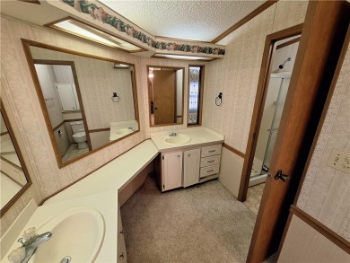 Perfect for seasonal home or rental opportunity! This spacious on Barefoot Bay Golf Course in Florida - for sale on GolfHomes.com, golf home, golf lot