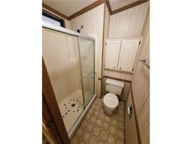 Perfect for seasonal home or rental opportunity! This spacious on Barefoot Bay Golf Course in Florida - for sale on GolfHomes.com, golf home, golf lot