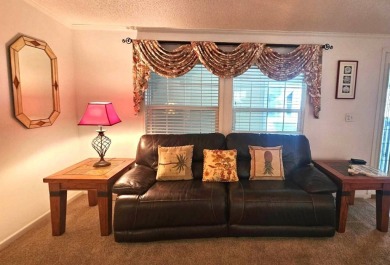 This home is on leased land, meaning buyers do not own the land on Big Cypress Golf and Country Club in Florida - for sale on GolfHomes.com, golf home, golf lot